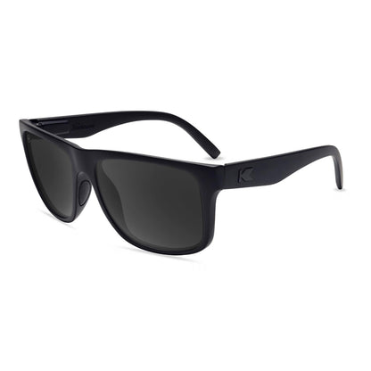 https://cdn.shopify.com/s/files/1/1356/7869/files/affordable-sport-sunglasses-black-on-black-torrey-pines-flyover.jpg?v=1775848521